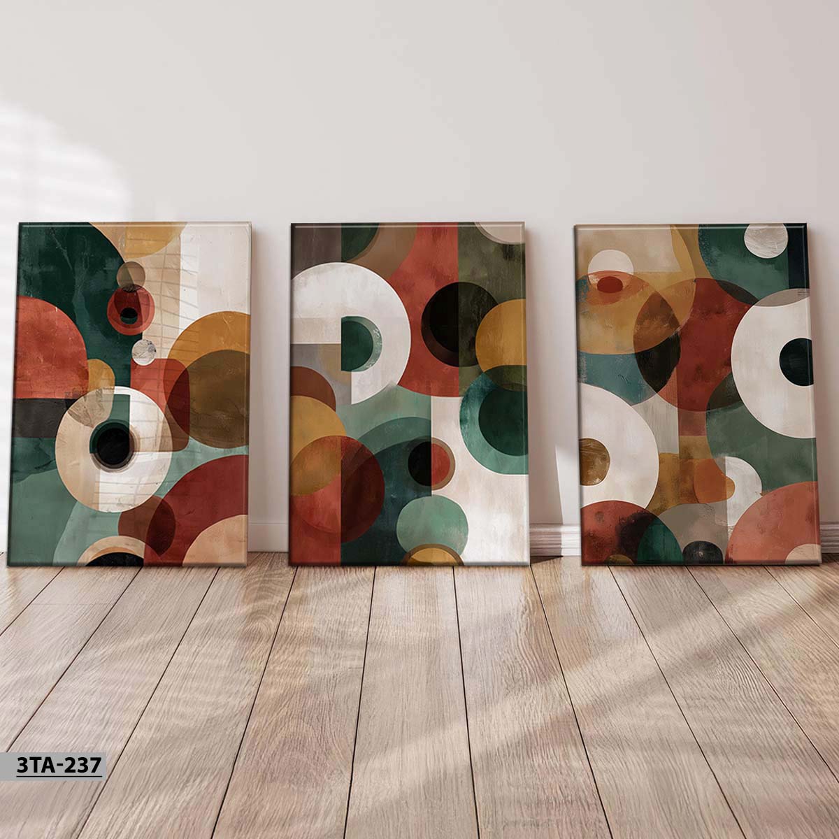 aliprint Trois tableaux décoratifs modernes en Algérie, présentant des motifs géométriques colorés sur un fond élégant.